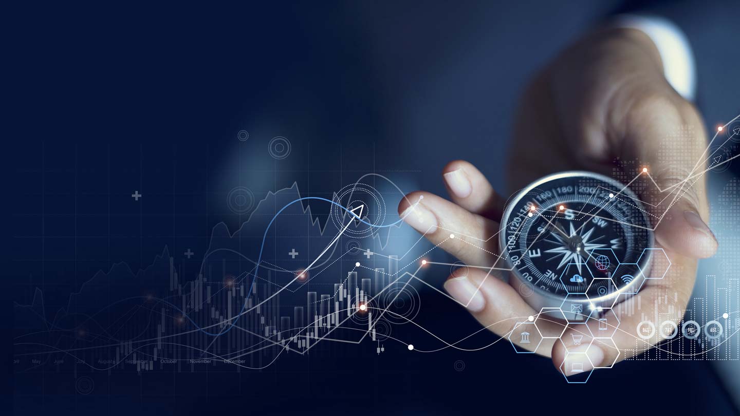 A hand holding a compass against a backdrop of digital graphs and data visualizations, symbolizing navigation and data-driven decision-making in a technological or business context.